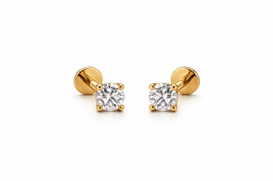 Gold earrings with AAAAA CZ studs on a white background